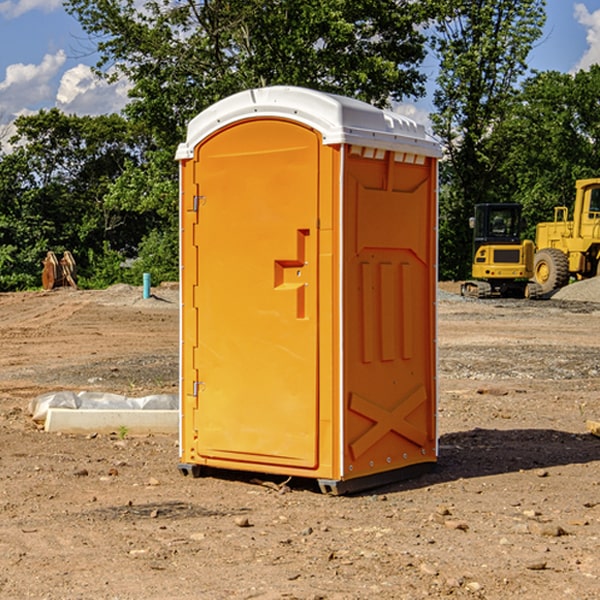 what is the cost difference between standard and deluxe portable toilet rentals in Newtown Grant